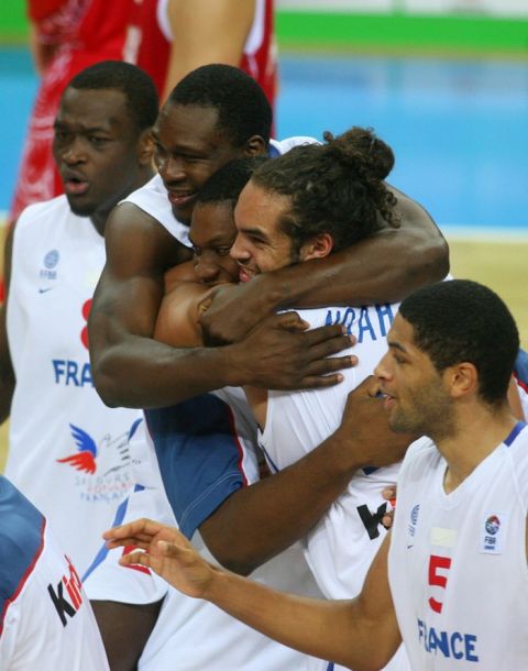 France's players celebrate their team's victory during the EuroBasket2011 semi-final match between France and Russia in Kaunas, on 16 September, 2011. By winning this game, France will compete against Spain in the EuroBasket 2011 final and also qualifies for the 2012 Olympic Games in London. AFP PHOTO/PETRAS MALUKAS (Photo credit should read PETRAS MALUKAS/AFP/Getty Images)