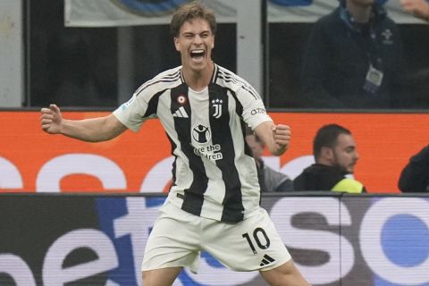 Juventus' Kenan Yildiz, left, celebrates after scoring his side's fourth goal during a Serie A soccer match between Inter Milan and Juventus at the San Siro stadium in Milan, Italy, Sunday, Oct. 27, 2024. (AP Photo/Luca Bruno)