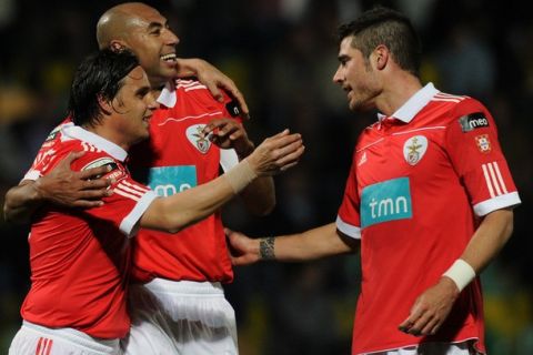 Benfica's forward Nuno Gomes (L) celebrates with teammates after scoring against Pacos de Ferreira during their Portuguese League football match at Mata Real Stadium in Pacos de Ferreira  on March 21, 2011. AFP PHOTO/ FRANCISCO LEONG (Photo credit should read FRANCISCO LEONG/AFP/Getty Images)