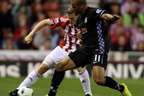 STOKE ON TRENT, ENGLAND - SEPTEMBER 13:  Robert Huth of Stoke City battles for the ball with Gabriel Agbonlahor of Aston Villa during the Barclays Premier League match between Stoke City and Aston Villa at The Britannia Stadium on September 13, 2010 in Stoke on Trent, England.  (Photo by Ross Kinnaird/Getty Images)