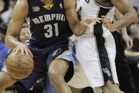 Memphis Grizzlies' Shane Battier, left, drives around San Antonio Spurs' Gary Neal during the second half of an NBA playoff basketball game, Sunday, April 17, 2011, in San Antonio. Memphis won 101-98. (AP Photo/Darren Abate)