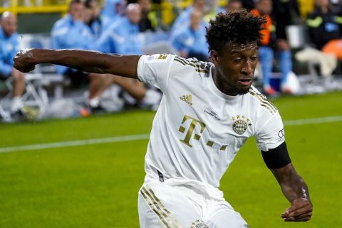 Bayern Munich's Kingsley Coman takes a shot during the first half of the team's friendly soccer match against Manchester City on Saturday, July 23, 2022, at Lambeau Field in Green Bay, Wis. (AP Photo/Morry Gash)