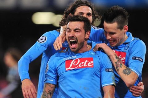 Napoli's Argentine forward Ezequiel Ivan Lavezzi (L) celebrates vwith  Napoli's Uruguayan forward Edinson Roberto Cavani (back) after scoring during the Champions League round of 16 first leg football match, Napoli vs Chelsea at San Paolo stadium in Naples on February 21, 2012.   AFP PHOTO / ALBERTO PIZZOLI (Photo credit should read ALBERTO PIZZOLI/AFP/Getty Images)