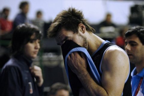 Basketball player Martin Osimani of Uruguay leaves the field after being defeated by Canada in the qualifying round match of the 2011 FIBA Americas Championship, on September 7, 2011 at Islas Malvinas Stadium, Mar del Plata, Buenos Aires, Argentina. AFP PHOTO/Maxi FAILLA (Photo credit should read Maxi Failla/AFP/Getty Images)