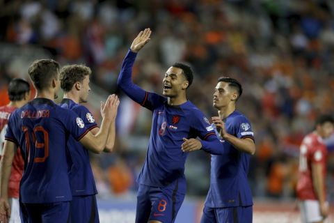Netherlands's Cody Gakpo, center, celebrates after scoring his side's sixth goal during the Euro 2024 group B qualifying soccer match between Gibraltar and the Netherlands, at the Argarve Stadium outside Faro, Portugal, Tuesday, Nov. 21, 2023. (AP Photo/Joao Matos)
