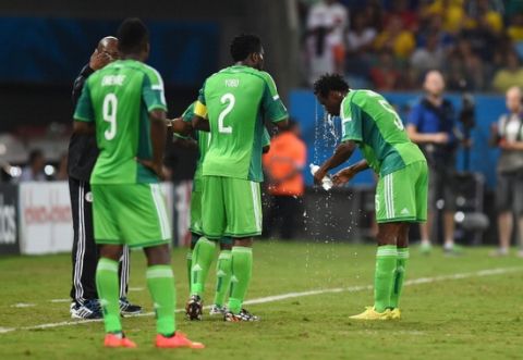 CUIABA, BRAZIL - JUNE 21:  Nigeria players cool off during the 2014 FIFA World Cup Group F match between Nigeria and Bosnia-Herzegovina at Arena Pantanal on June 21, 2014 in Cuiaba, Brazil.  (Photo by Stu Forster/Getty Images)