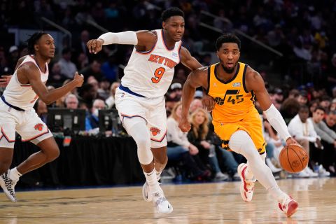 Utah Jazz's Donovan Mitchell (45), right, makes a move around New York Knicks' RJ Barrett (9) during the second half of an NBA basketball game, Sunday, March 20, 2022, in New York. The Jazz defeated the Knicks 108-93. (AP Photo/Seth Wenig)