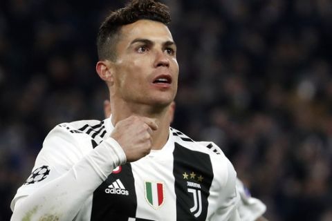 Juventus' Cristiano Ronaldo celebrates after scoring his side's third goal during the Champions League round of 16, 2nd leg, soccer match between Juventus and Atletico Madrid at the Allianz stadium in Turin, Italy, Tuesday, March 12, 2019. (AP Photo/Antonio Calanni)