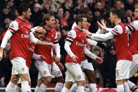 Arsenal's Santi Cazorla celebrates his goal during the Barclays Premier League match at the Emirates Stadium, London.