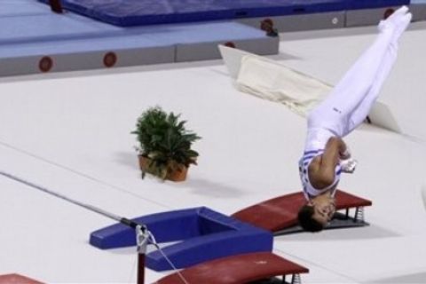 Greece's Maras Vlasios competes on the High Bar for the Silver medal during the Gymnastics World Cup in Ghent, Belgium on Sunday, Sept. 12, 2010. (AP Photo/ Virginia Mayo)