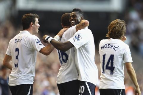 LONDON, ENGLAND - OCTOBER 02:  Kyle Walker of Tottenham Hotspur (second left) celebrates scoring his side's second goal with team mates Gareth Bale (L), Emmanuel Adebayor and Luka Modric during the Barclays Premier League match between Tottenham Hotspur and Arsenal at White Hart Lane on October 2, 2011 in London, England.  (Photo by Julian Finney/Getty Images)