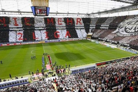 Supporters of Eintracht Frankfurt present a huge choreography reading "never ever second division again" prior to their German second division Bundesliga soccer match against TSV 1860 Munich in Frankfurt April 29, 2012. Frankfurt was already promoted into the first division Bundesliga.     REUTERS/Kai Pfaffenbach (GERMANY - Tags: SPORT SOCCER) DFL LIMITS USE OF IMAGES ON THE INTERNET TO 15 PICTURES DURING THE MATCH AND, PROHIBITS MOBILE (MMS) USE DURING AND UP TO 2 HOURS POST MATCH. FOR MORE INFORMATION CONTACT DFL