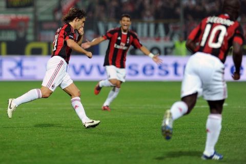 A.C. Milan's midfielder Andrea Pirlo (L) celebrates after scoring during their Italian serie A football match between Parma Fc and AC Milan at the Ennio Tardini stadium in Parma on October 2, 2010.  AFP PHOTO / ALBERTO PIZZOLI (Photo credit should read ALBERTO PIZZOLI/AFP/Getty Images)