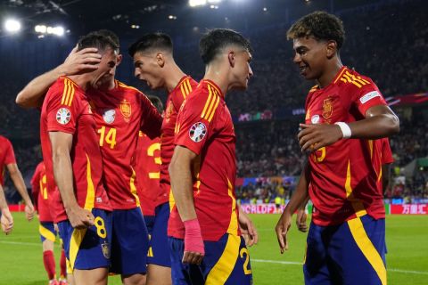 Spain's Fabian Ruiz, left, celebrates with teammates after scoring his sides second goal during a round of sixteen match between Spain and Georgia at the Euro 2024 soccer tournament in Cologne, Germany, Sunday, June 30, 2024. (AP Photo/Manu Fernandez)