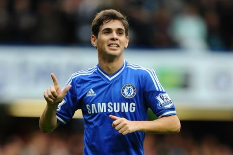 LONDON, ENGLAND - OCTOBER 19:  Oscar of Chelsea celebrates scoring his side's third goal during the Barclays Premier League match between Chelsea and Cardiff City at Stamford Bridge on October 19, 2013 in London, England.  (Photo by Mike Hewitt/Getty Images)