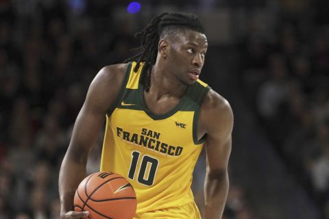 San Francisco forward Jonathan Mogbo controls the ball during the second half of an NCAA college basketball game against Gonzaga, Thursday, Jan. 25, 2024, in Spokane, Wash. (AP Photo/Young Kwak)