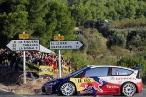 Sebastien Loeb of France and his co-driver driver Daniel Elena from Monaco compete with their Citroen during a second stage of the Rally of Catalonia in El Molar, Spain, Saturday, Oct. 3, 2009. (AP Photo/Manu Fernandez)