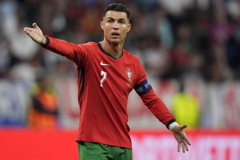 Portugal's Cristiano Ronaldo reacts during a round of sixteen match between Portugal and Slovenia at the Euro 2024 soccer tournament in Frankfurt, Germany, Monday, July 1, 2024. (AP Photo/Matthias Schrader)