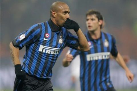 Inter Milan Brazilian defender Maicon, celebrates after scoring during the Italian Cup eight final soccer match between Inter Milan and Genoa, at the San Siro stadium in Milan, Italy, Thursday, Jan. 19, 2012. In background is seen Inter Milan midfielder Andrea Poli. (AP Photo/Luca Bruno)