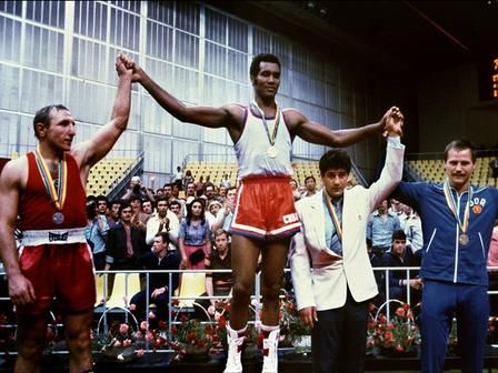 Cuban champion Teofilo Stevenson (C-gold medal) Soviet Pyotr Zaev (L-silver medal) and German Republic Democratic Jurgen Fanghanel (R- bronze medal) wawe on the podium of the Olympic heavyweight 81+ boxing event that won Teofilo Stevenson. Stevenson --who won 301 of the 321 fights he took part-- died of a heart attack at the age of 60 in Havana on June 11, 2012. AFP PHOTO
