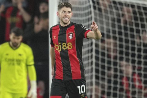 Bournemouth's Ryan Christie celebrates after scoring his side's opening goal during the English Premier League soccer match between Bournemouth and Arsenal at the Vitality Stadium in Bournemouth, England, Saturday, Oct. 19, 2024. (AP Photo/Kin Cheung)