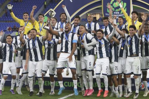 CF Pachuca players celebrate with the trophy after winning their Intercontinental Cup soccer match against Al Ahly FC at Stadium 974 in Doha, Qatar, Saturday, Dec. 14, 2024. (AP Photo/Hussein Sayed)