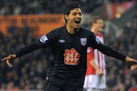 West Bromwich Albion's Mexican forward Carlos Vela celebrates after scoring during the English Premier League football match against Stoke at The Britannia stadium, Stoke-on-Trent, England on February 28, 2011. AFP PHOTO/ ANDREW YATESFOR  EDITORIAL USE Additional licence required for any commercial/promotional use or use on TV or internet (except identical online version of newspaper) of Premier League/Football League photos. Tel DataCo +44 207 2981656. Do not alter/modify photo (Photo credit should read ANDREW YATES/AFP/Getty Images)