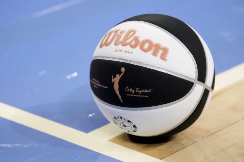 A Commissioner's Cup basketball sits on the court during a WNBA basketball game between the Chicago Sky and the New York Liberty Tuesday, June 4, 2024, in Chicago. (AP Photo/Charles Rex Arbogast)