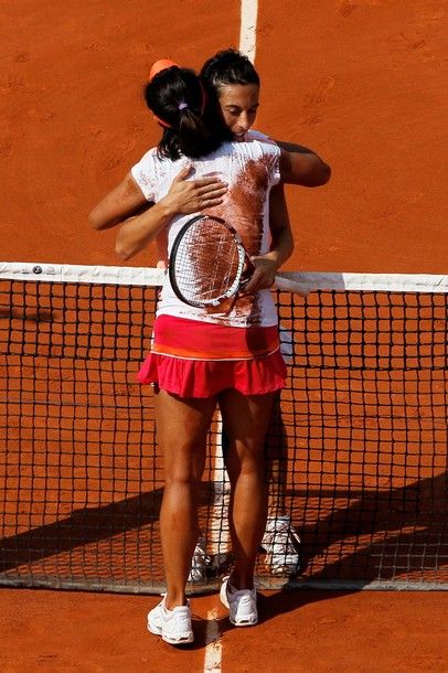 PARIS, FRANCE - JUNE 04:  Na Li of China is hugged by Francesca Schiavone of Italy following her victory during the women's singles final match between Francesca Schiavone of Italy and Na Li of China on day fourteen of the French Open at Roland Garros on June 4, 2011 in Paris, France.  (Photo by Matthew Stockman/Getty Images)