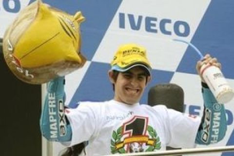 Spain's 125cc rider Julian Simon of Bancaja Aspar Team celebrates after winning the 125cc race and world championship  at the 2009 Australian MotoGP on Phillip Island, Australia, Sunday, Oct. 18, 2009. Simon won the race and claimed the 2009 125cc world title. (AP Photo/Rob Griffith)