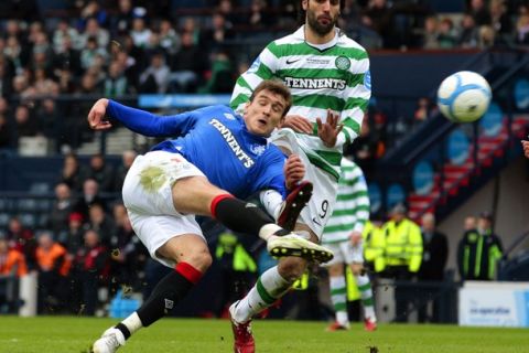 Rangers' Nikica Jelavic attempts a shot at goal during their CIS Cup final soccer match against Celtic at Hampden Park stadium in Glasgow, Scotland March 20, 2011. REUTERS/David Moir (BRITAIN - Tags: SPORT SOCCER)