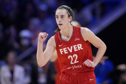 Indiana Fever's Caitlin Clark celebrates in the second half of a WNBA basketball game against the Dallas Wings, Wednesday, July 17, 2024, in Arlington, Texas. (AP Photo/Tony Gutierrez)