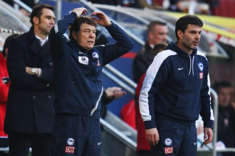 AUGSBURG, GERMANY - FEBRUARY 25: Head coach Otto Rehhagel (C), assistant coach Rene Tretschok (R) and manager Michael Preetz (L) of Berlin react during the Bundesliga match between FC Augsburg and Hertha BSC Berlin at SGL Arena on February 25, 2012 in Augsburg, Germany.  (Photo by Alex Grimm/Bongarts/Getty Images)