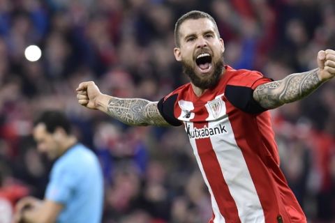 Athletic Bilbao's Inigo Martinez celebrates at the end of the Spanish Copa del Rey, quarter final, soccer match between Athletic Bilbao and Barcelona at San Mames stadium in Bilbao, Spain, Thursday, Feb. 6, 2020. Athletic Bilbao won 1-0. (AP Photo/Alvaro Barrientos)