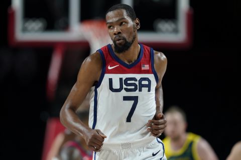 FILE - United States's Kevin Durant (7) runs up the court after making a three point basket during a men's basketball semifinal game against Australia at the 2020 Summer Olympics, Thursday, Aug. 5, 2021, in Saitama, Japan. Durant is seeking to become the first four-time men's basketball gold medalist, after helping the U.S. win gold at Tokyo in 2021, Rio de Janeiro in 2016 and London in 2012. (AP Photo/Charlie Neibergall, File)