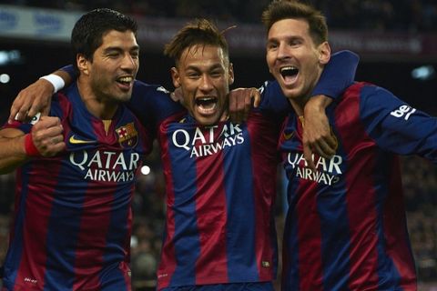 FC Barcelona's Lionel Messi, from Argentine, right, Neymar, from Brazil, center, and Luis Suarez, from Uruguay, celebrate after scoring against Atletico Madrid during a Spanish La Liga soccer match at the Camp Nou stadium in Barcelona, Spain, Sunday, Jan. 11, 2015. (AP Photo/Siu Wu)