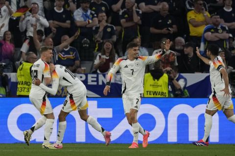 Germany's Maximilian Mittelstadt, Jamal Musiala, Kai Havertz and Ilkay Gundogan, from left, celebrate after the second goal by Musiala during a Group A match between Germany and Scotland at the Euro 2024 soccer tournament in Munich, Germany, Friday, June 14, 2024. (AP Photo/Frank Augstein)