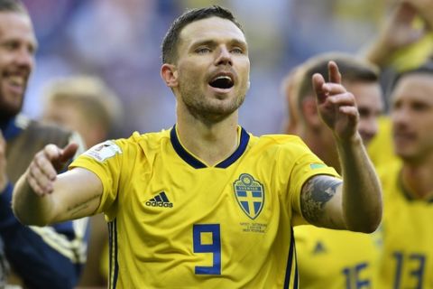 Sweden's Marcus Berg celebrates with teammates after winning the round of 16 match between Switzerland and Sweden at the 2018 soccer World Cup in the St. Petersburg Stadium, in St. Petersburg, Russia, Tuesday, July 3, 2018. (AP Photo/Martin Meissner)