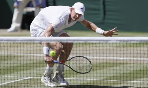 South Africa's Kevin Anderson returns the ball to Serbia's Novak Djokovic during the men's singles final match, at the Wimbledon Tennis Championships, in London, Sunday July 15, 2018.(AP Photo/Kirsty Wigglesworth)