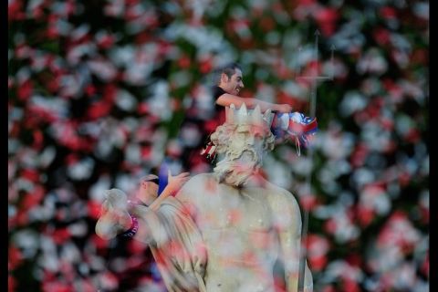 MADRID, SPAIN - MAY 10:  Atletico Madrid captain Diego Lopez puts the team colors on the Neptune statue a day after Atletico won the Europa League Final on May 10, 2012 in Madrid, Spain. Atletico beat Athletic Bilbao 3-0 in the final in Bucharest.  (Photo by Denis Doyle/Getty Images)