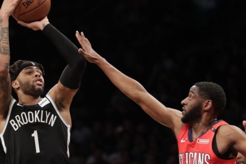 Brooklyn Nets' D'Angelo Russell (1) shoots over New Orleans Pelicans' Ian Clark (2) during the second half of an NBA basketball game Wednesday, Jan. 2, 2019, in New York. (AP Photo/Frank Franklin II)