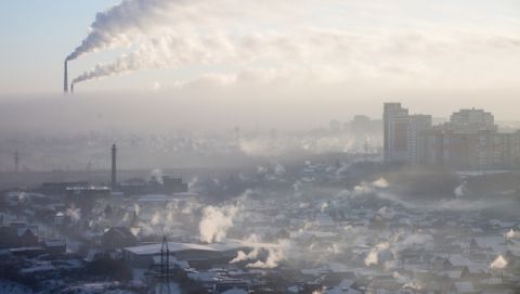 Smoke rises from chimneys on a frosty morning in Omsk, Russia, Thursday, Jan. 25, 2018. The temperature in Omsk dropped to -30 degrees Centigrade (-22 degrees Fahrenheit). (AP Photo/Dmitry Feoktistov)