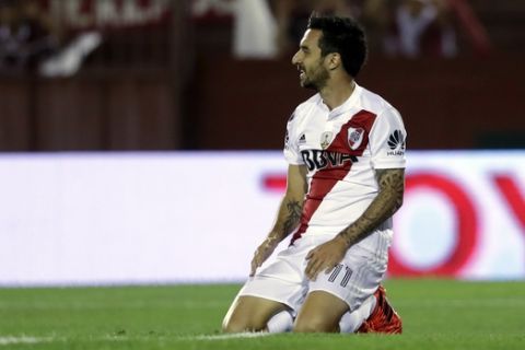 Argentina's River Plate Ignacio Scocco sits on the grass during a semifinals Copa Libertadores soccer match against Lanus in Buenos Aires, Argentina, Tuesday, Oct. 31, 2017. (AP Photo/Natacha Pisarenko)