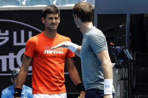 Britain's Andy Murray, right, gestures to Serbia's Novak Djokovic during a practice match on Margaret Court Arena ahead of the Australian Open tennis championships IN Melbourne, Australia, Thursday, Jan. 10, 2019. (AP Photo/Mark Baker)