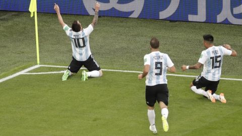 Argentina's Lionel Messi, left, celebrates after scoring the opening goal during the group D match between Argentina and Nigeria, at the 2018 soccer World Cup in the St. Petersburg Stadium in St. Petersburg, Russia, Tuesday, June 26, 2018. (AP Photo/Michael Sohn)