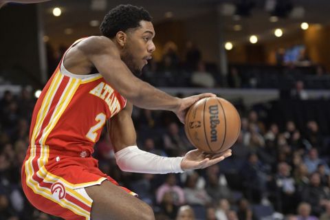 Atlanta Hawks guard Trent Forrest (2) handles the ball against Memphis Grizzlies forward Jaren Jackson Jr. (13) in the first half of an NBA basketball game Monday, Dec. 12, 2022, in Memphis, Tenn. (AP Photo/Brandon Dill)