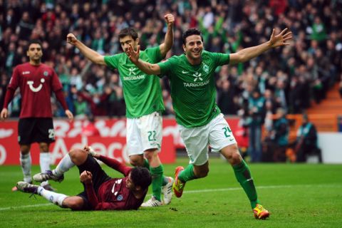 BREMEN, GERMANY - MARCH 11: Claudio Pizarro of Bremen celebrates after scoring his teams first goal during the Bundesliga match between SV Werder Bremen and Hannover 96 at Weser Stadium on March 11, 2012 in Bremen, Germany.  (Photo by Lars Baron/Bongarts/Getty Images)