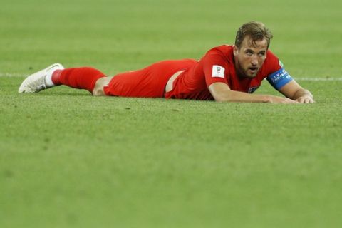 England's Harry Kane lies on the pitch during the round of 16 match between Colombia and England at the 2018 soccer World Cup in the Spartak Stadium, in Moscow, Russia, Tuesday, July 3, 2018. (AP Photo/Victor R. Caivano)