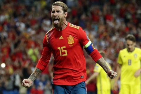 Spain's Sergio Ramos celebrates after scoring the opening goal with a penalty during the Euro 2020 Group F qualifying soccer match between Spain and Sweden at the Santiago Bernabeu stadium in Madrid, Monday June 10, 2019. (AP Photo/Manu Fernandez)