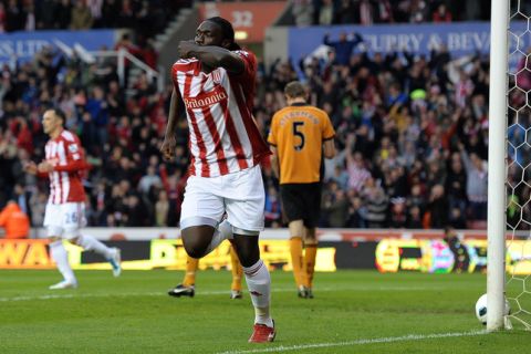 Stoke City's Trinidadian forward Kenwyne Jones (C) celebrates after scoring during the English Premier League football match between Stoke City and Wolverhampton Wanderers at The Britannia Stadium in Stoke-on-Trent, England, on April 26, 2011. AFP PHOTO/PAUL ELLIS - FOR EDITORIAL USE ONLY Additional licence required for any commercial/promotional use or use on TV or internet (except identical online version of newspaper) of Premier League/Football League photos. Tel DataCo +44 207 2981656. Do not alter/modify photo. (Photo credit should read PAUL ELLIS/AFP/Getty Images)